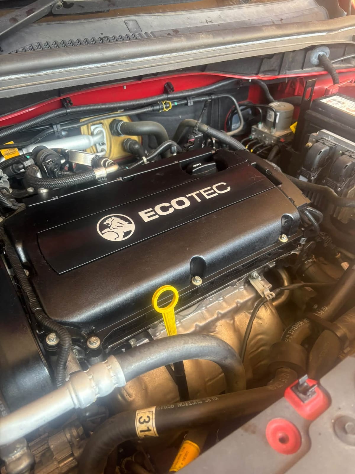 Holden Ecotec engine cover refitted after the repair
