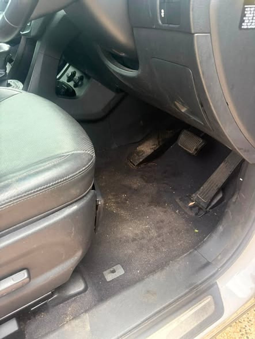 Driver side floor and seat before the interior clean